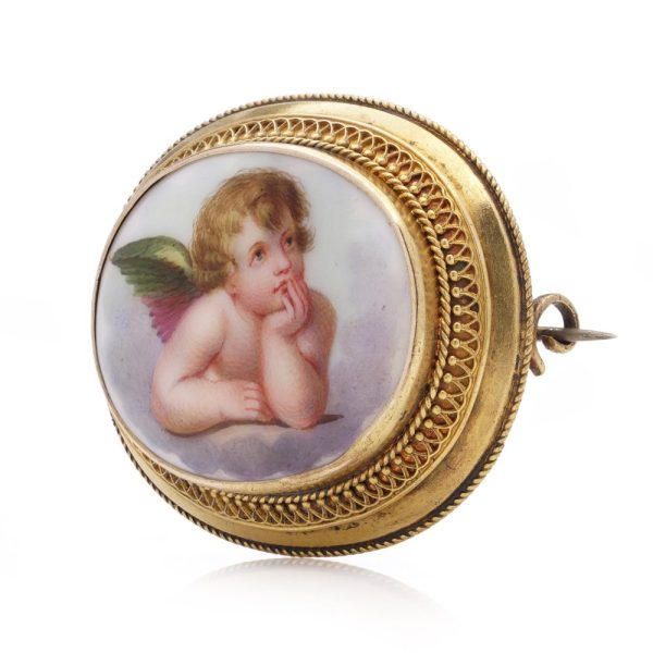 Victorian enamel cherub brooch in gold.