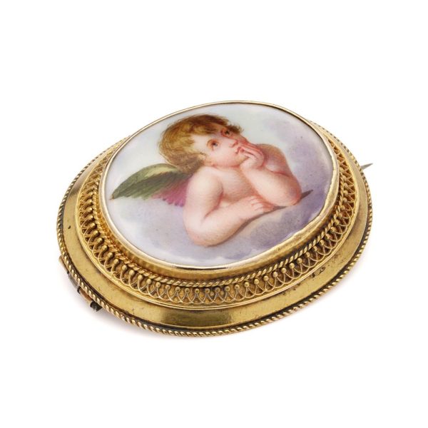 Victorian enamel cherub brooch in gold.