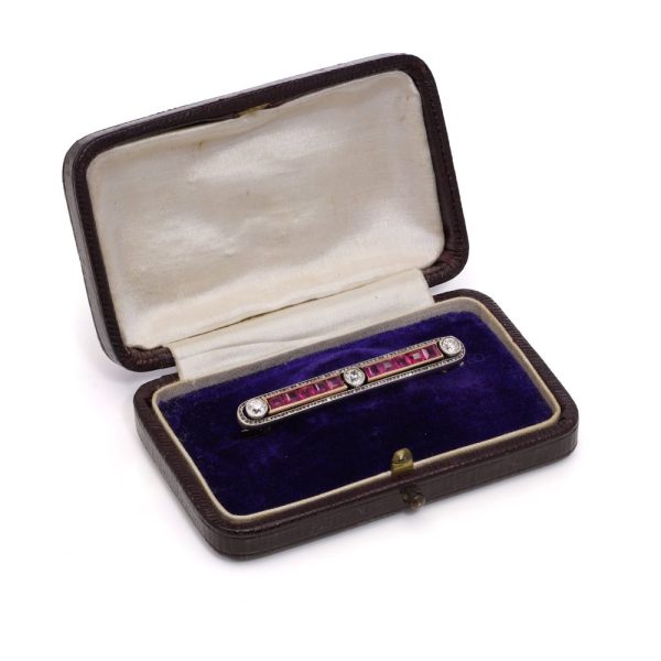 Antique ruby and diamond bar brooch in gold and silver.