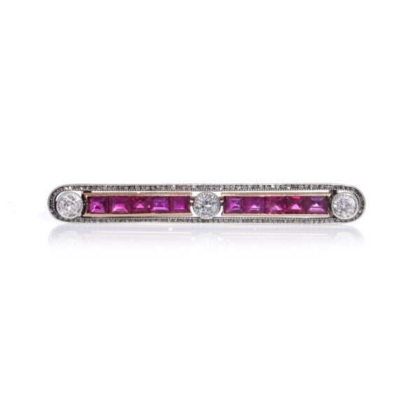 Antique ruby and diamond bar brooch in gold and silver.