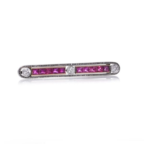 Antique ruby and diamond bar brooch in gold and silver.