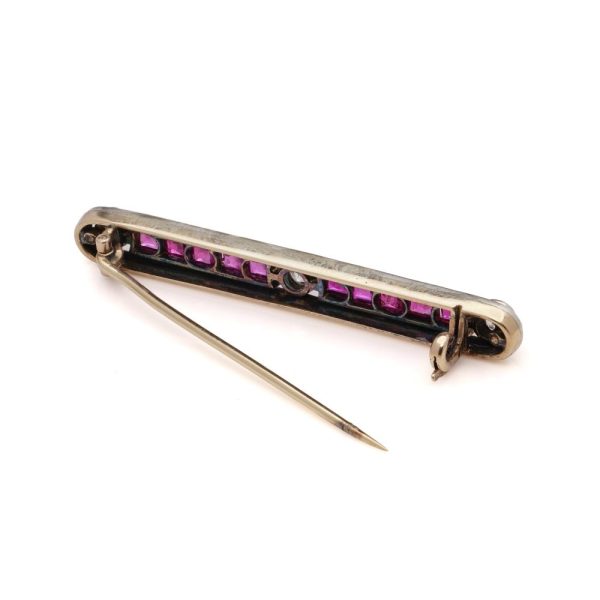 Antique ruby and diamond bar brooch in gold and silver.