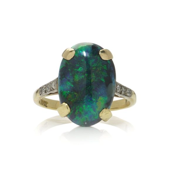 Vintage black opal and diamond ring in gold.