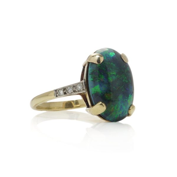 Vintage black opal and diamond ring in gold.
