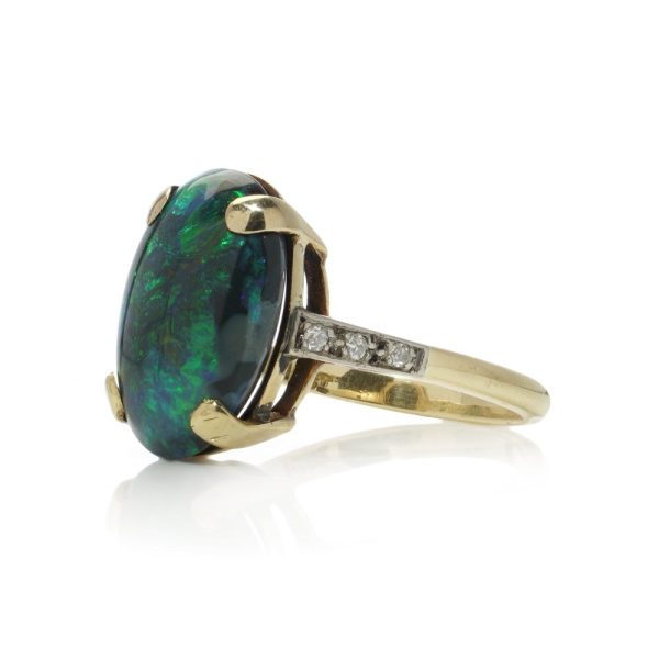 Vintage black opal and diamond ring in gold.