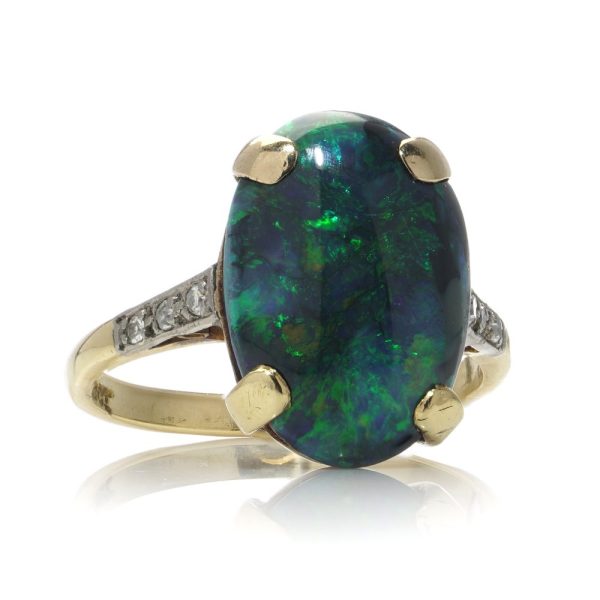 Vintage black opal and diamond ring in gold.