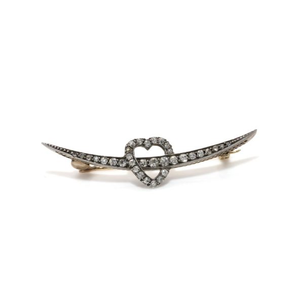 Victorian heart and arrow diamond brooch in gold and silver.