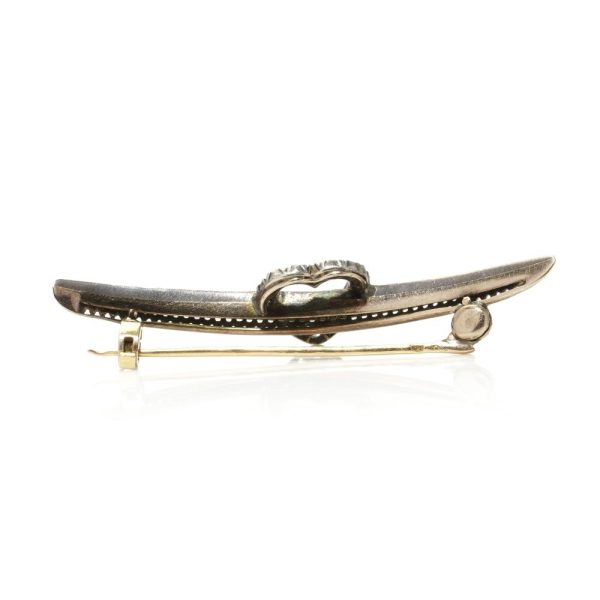 Victorian heart and arrow diamond brooch in gold and silver.