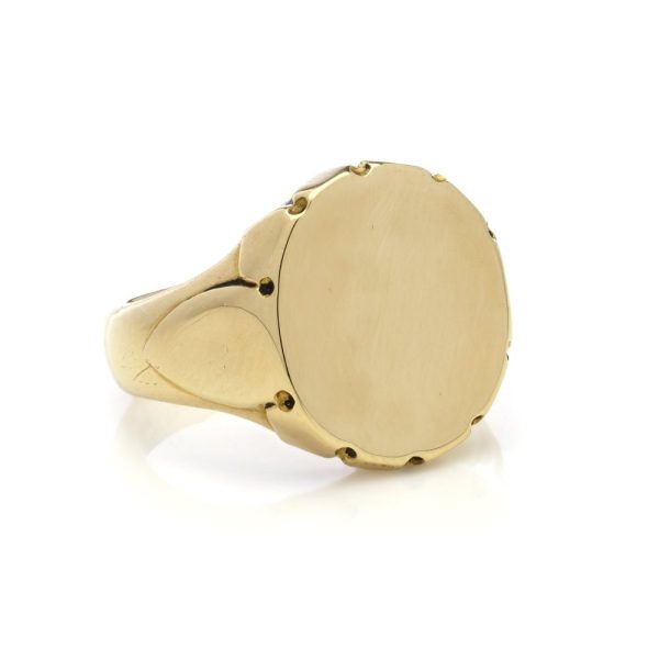 Plain gold signet ring.