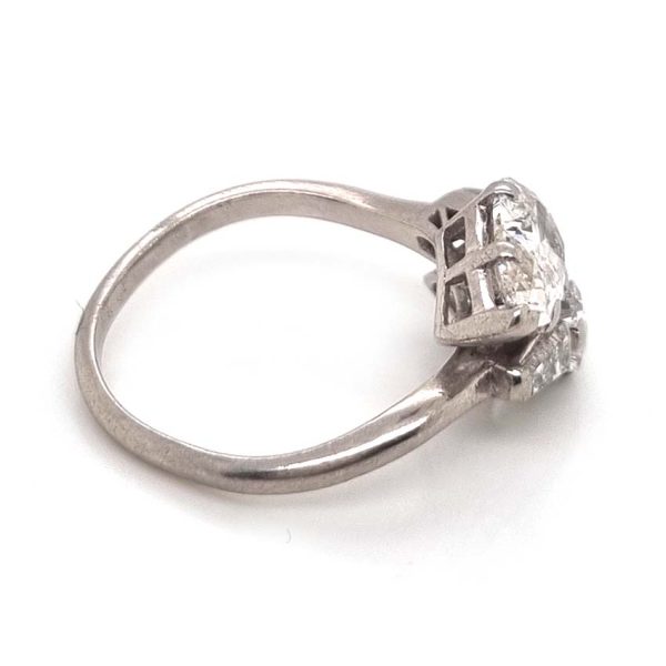 Art Deco Pear Diamond Toi et Moi Crossover Engagement Ring in Platinum, antique diamond two stone ring, Two pear-shaped old cut diamonds lead to tapered baguette diamonds
