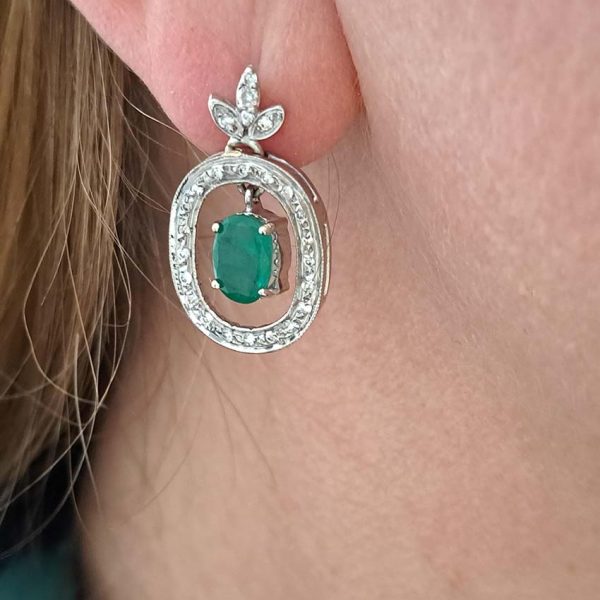Vintage 1.7ct Emerald and Diamond Oval Cluster Drop Earrings, 7.14ct oval emerald pendant drops within fixed oval diamond-set halo surrounds from diamond fleur-de-lis tops in 18ct white gold