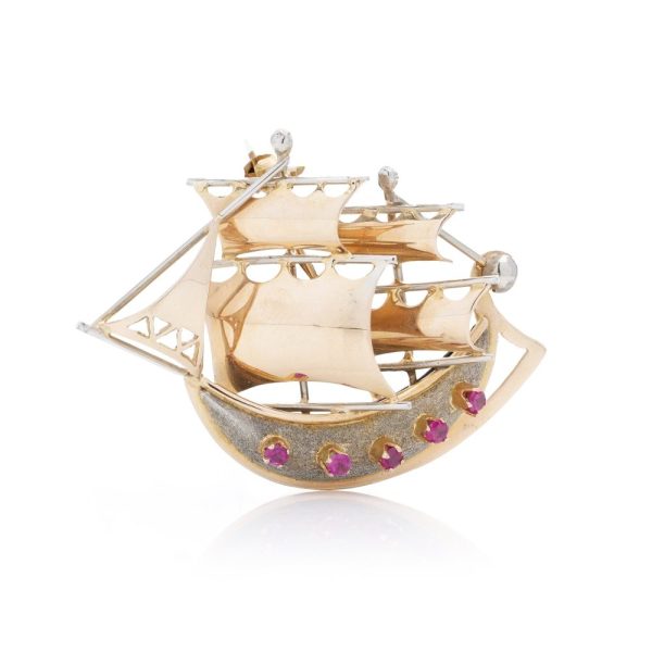 Gold sailing ship brooch with rubies.