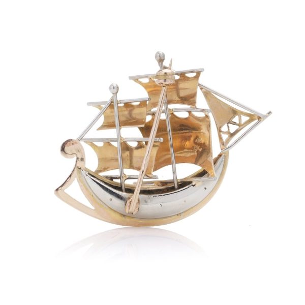 Gold sailing ship brooch with rubies.
