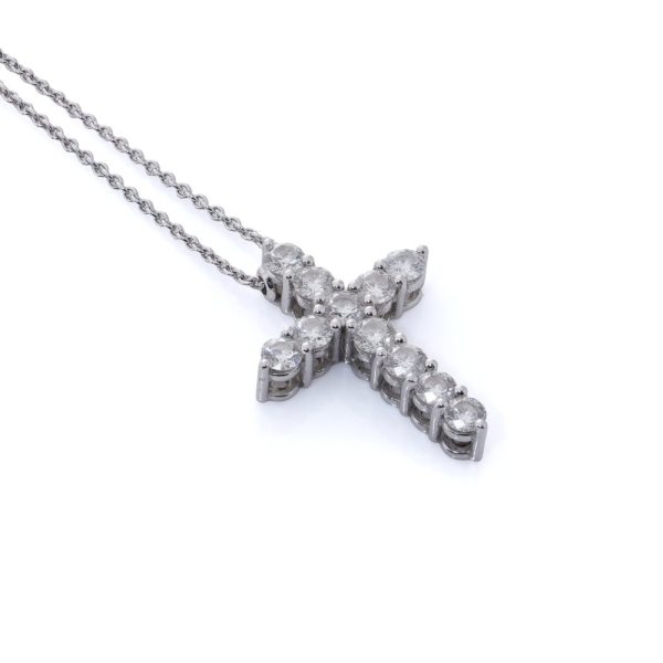 Diamond cross pendant in white gold.