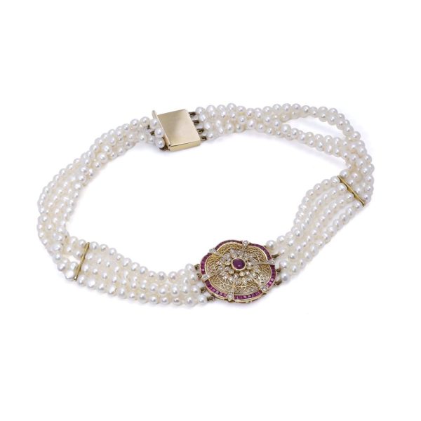 Diamond, ruby and pearl choker necklace in gold.