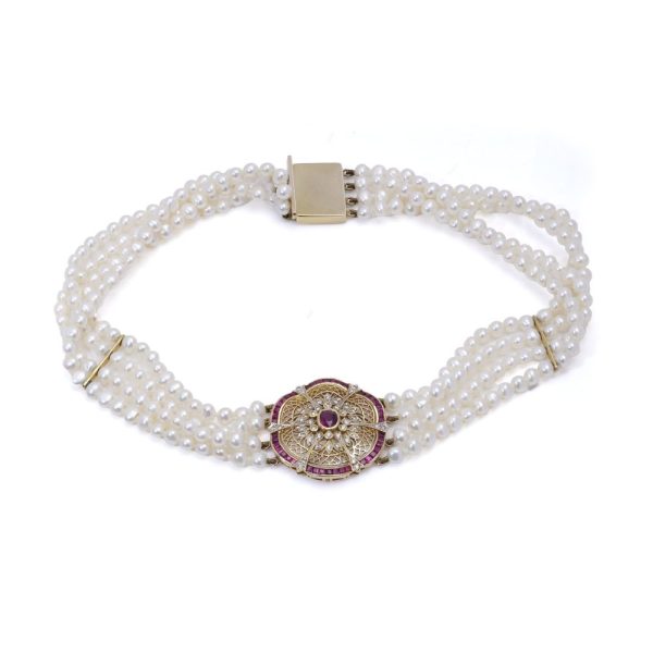 Diamond, ruby and pearl choker necklace in gold.