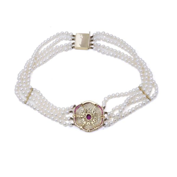 Diamond, ruby and pearl choker necklace in gold.