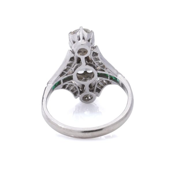 Diamond and emerald ring in platinum.