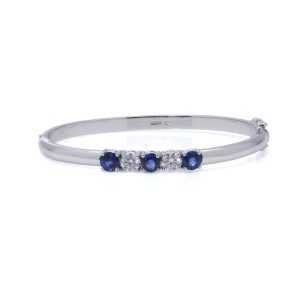 Platinum bangle with sapphires and diamonds.