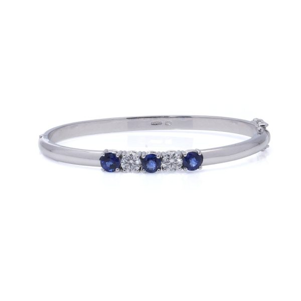 Platinum bangle with sapphires and diamonds.