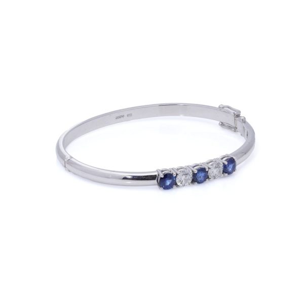 Platinum bangle with sapphires and diamonds.