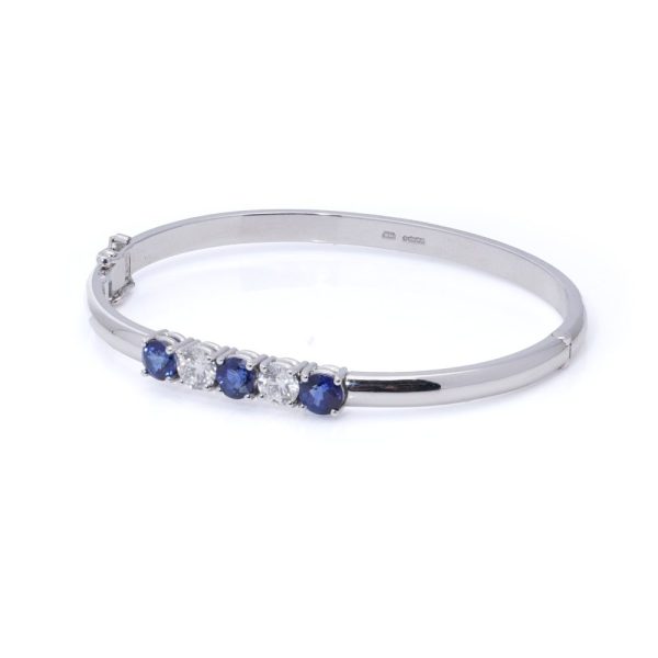 Platinum bangle with sapphires and diamonds.
