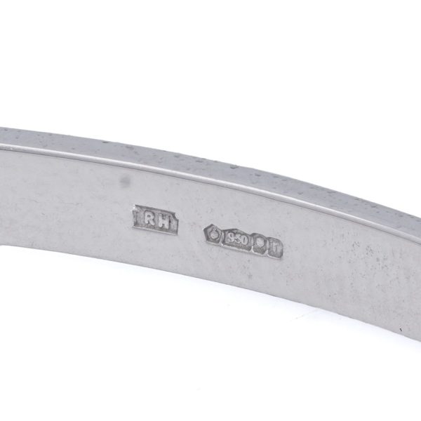 Platinum bangle with sapphires and diamonds.