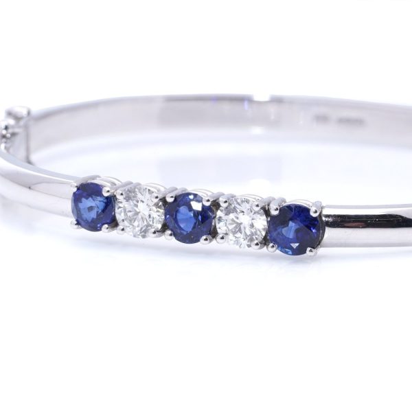 Platinum bangle with sapphires and diamonds.