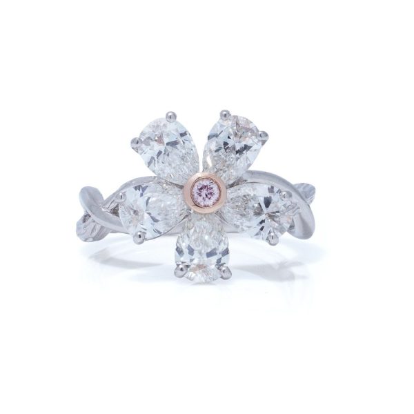 Platinum flower-shaped diamond ring.
