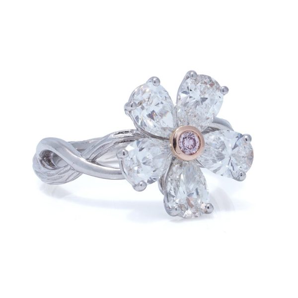 Platinum flower-shaped diamond ring.