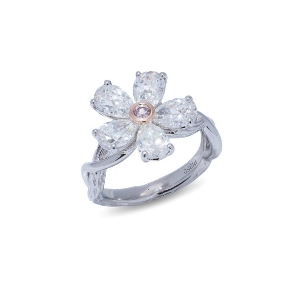 Platinum flower-shaped diamond ring.