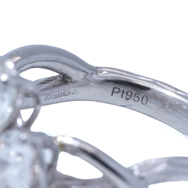 Platinum flower-shaped diamond ring.