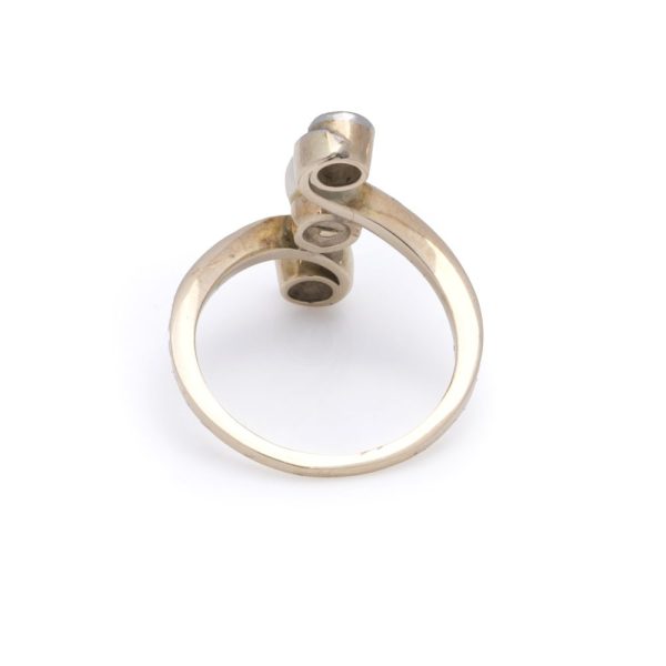 Antique pearl and diamond three stone ring in gold.