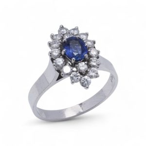 Vintage sapphire and diamond cluster ring in white gold.