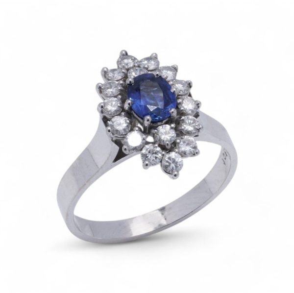 Vintage sapphire and diamond cluster ring in white gold.