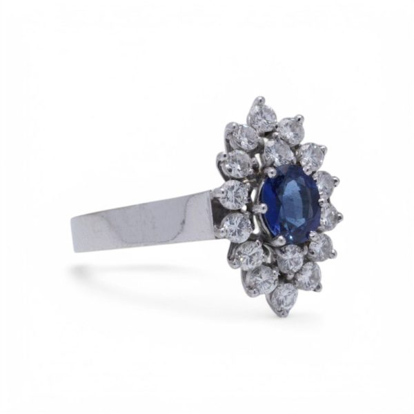 Vintage sapphire and diamond cluster ring in white gold.
