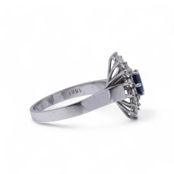 Vintage sapphire and diamond cluster ring in white gold.