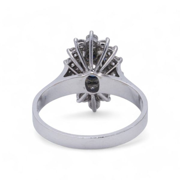 Vintage sapphire and diamond cluster ring in white gold.