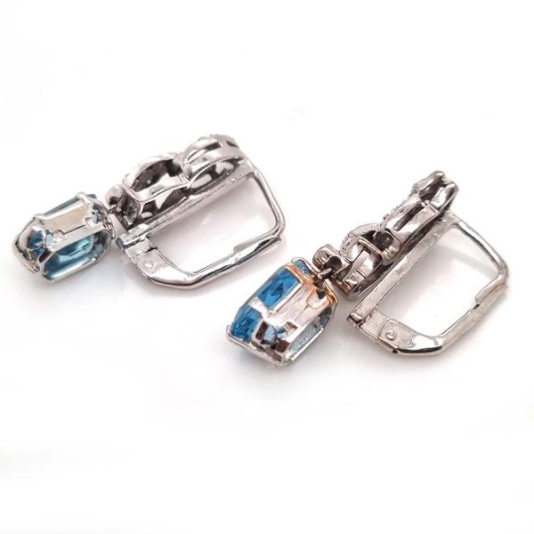 Art Deco Aquamarine and Diamond Drop Earrings, emerald-shaped step-cut aquamarines are suspended from diamond set tops in white gold. Circa 1920
