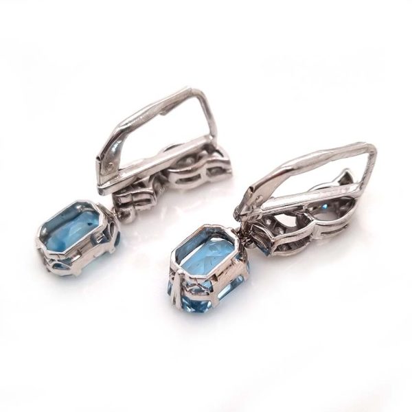 Art Deco Aquamarine and Diamond Drop Earrings, emerald-shaped step-cut aquamarines are suspended from diamond set tops in white gold. Circa 1920