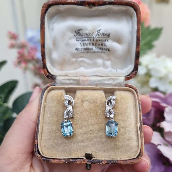 Art Deco Aquamarine and Diamond Drop Earrings, emerald-shaped step-cut aquamarines are suspended from diamond set tops in white gold. Circa 1920