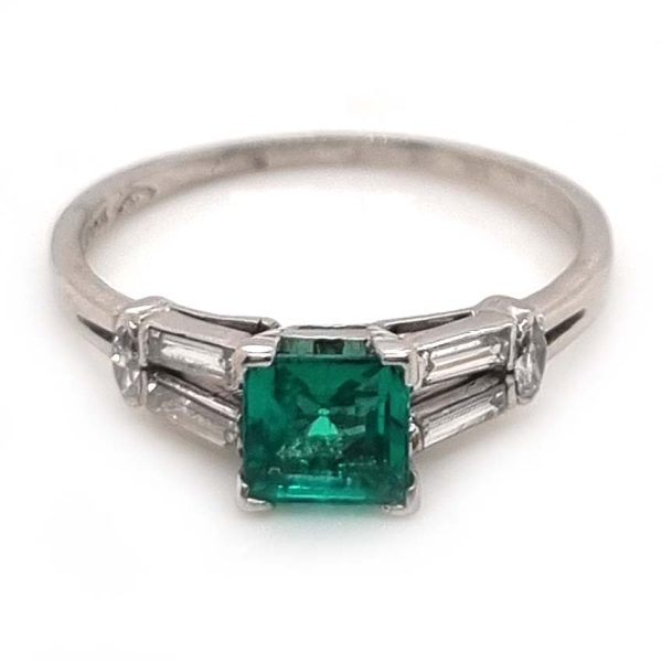 0.63ct Art Deco Colombian Emerald and Baguette Diamond Engagement Ring in Platinum, baguette diamond split shoulders to marquise diamond edges. Circa 1920