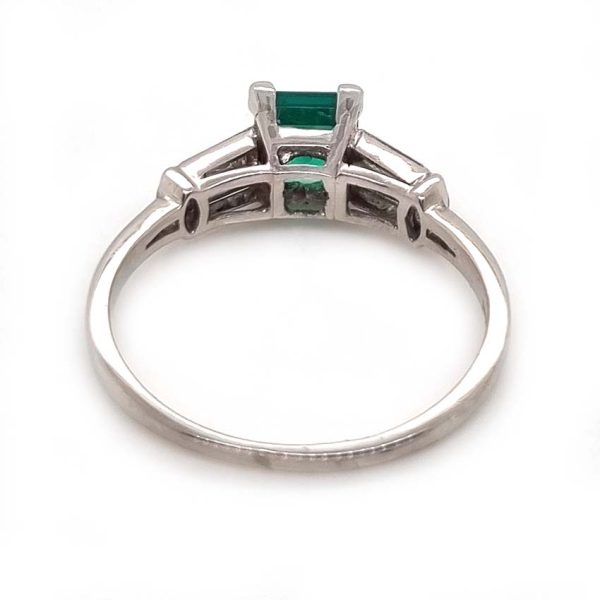 0.63ct Art Deco Colombian Emerald and Baguette Diamond Engagement Ring in Platinum, baguette diamond split shoulders to marquise diamond edges. Circa 1920