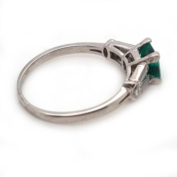 0.63ct Art Deco Colombian Emerald and Baguette Diamond Engagement Ring in Platinum, baguette diamond split shoulders to marquise diamond edges. Circa 1920