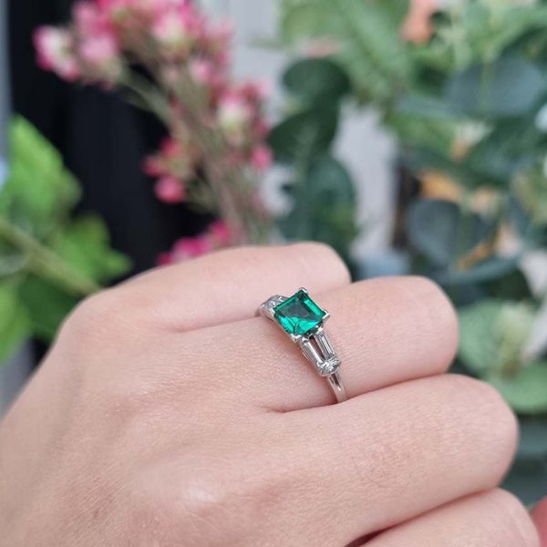 0.63ct Art Deco Colombian Emerald and Baguette Diamond Engagement Ring in Platinum, baguette diamond split shoulders to marquise diamond edges. Circa 1920
