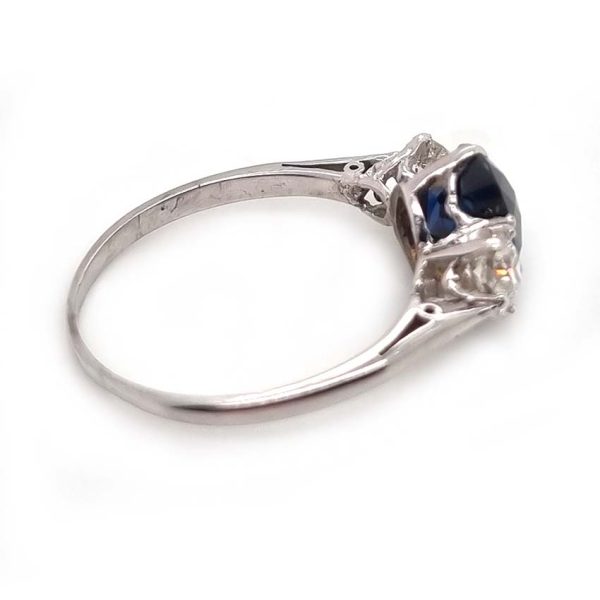 Art Deco 1.69ct Sapphire and Diamond Trilogy Three Stone Engagement Ring in Platinum, 1.69ct oval cushion-shaped Royal blue sapphire flanked by 0.60cts old mine-cut diamonds