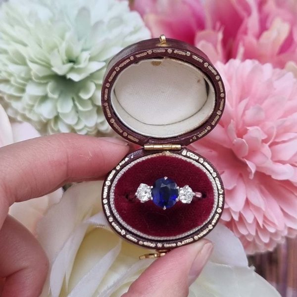 Art Deco 1.69ct Sapphire and Diamond Trilogy Three Stone Engagement Ring in Platinum, 1.69ct oval cushion-shaped Royal blue sapphire flanked by 0.60cts old mine-cut diamonds