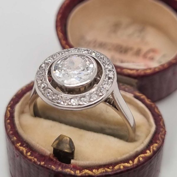 Art Deco 1.25ct Old Cut Diamond Halo Cluster Engagement Ring, 1.25ct old European cut diamond surrounded by fixed halo of old mine-cut diamonds in platinum
