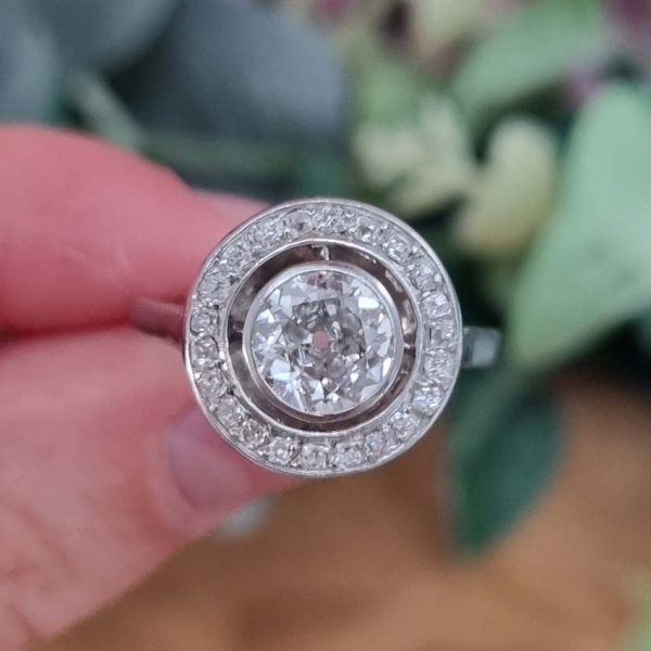 Art Deco 1.25ct Old Cut Diamond Halo Cluster Engagement Ring, 1.25ct old European cut diamond surrounded by fixed halo of old mine-cut diamonds in platinum