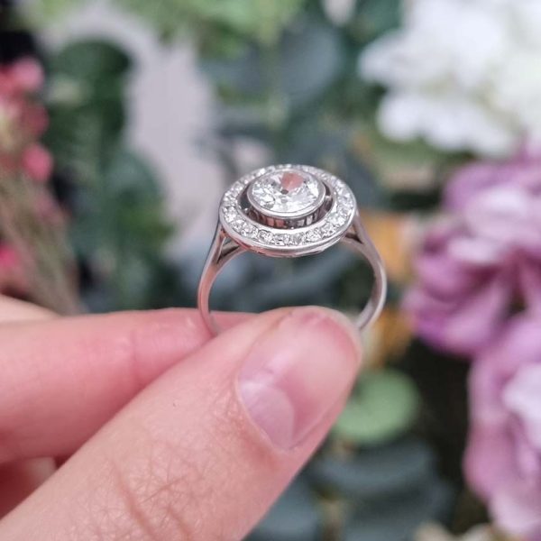Art Deco 1.25ct Old Cut Diamond Halo Cluster Engagement Ring, 1.25ct old European cut diamond surrounded by fixed halo of old mine-cut diamonds in platinum